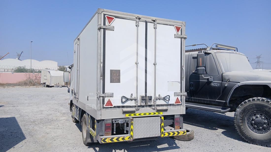2014 Isuzu NMR — Rear Left Angle — Photo 6