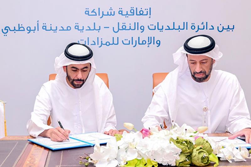 Abu Dhabi Municipality, Emirates Auction sign two agreements to handle the lease of investment assets and tow-away of abandoned vehicles