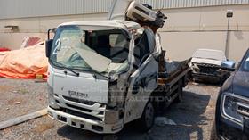 2023 Isuzu NMR — Front Left Angle — Photo 6 — Thumbnail
