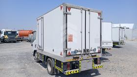 2014 Isuzu NMR — Rear Left Angle — Photo 6 — Thumbnail
