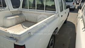 2009 Nissan Pick up D/C — Rear Left Angle — Photo 6 — Thumbnail