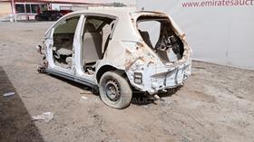 2011 Nissan Tiida — Rear Left Angle — Photo 5 — Thumbnail
