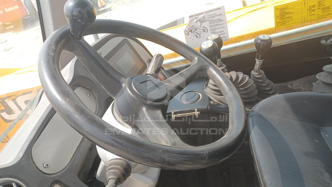 جي سي بي 540-70 2023 — التحكمات في عجلة القيادة — صورة 14