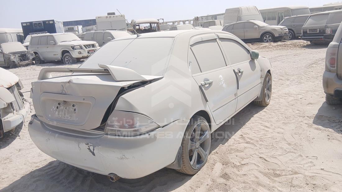 ميتسوبيشي لانسر 2009 — الزاوية الخلفية اليمنى — صورة 8