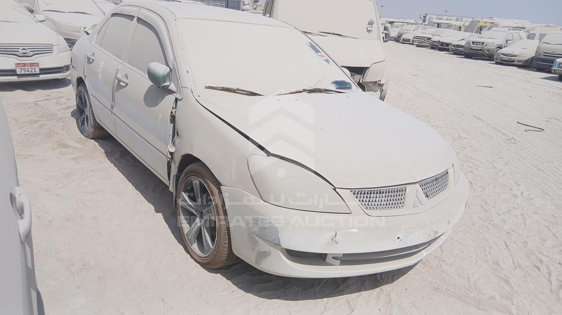 ميتسوبيشي لانسر 2009 — الزاوية الأمامية اليمنى — صورة 9