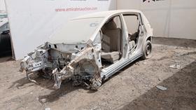 2011 Nissan Tiida — Front Left Angle — Photo 4 — Thumbnail