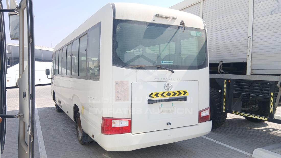 2020 Toyota Coaster — Rear Left Angle — Photo 6