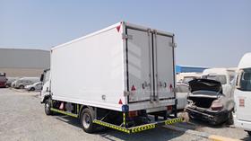 2026 Isuzu NPR — Rear Left Angle — Photo 6 — Thumbnail