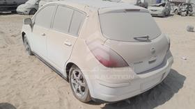 2013 Nissan Tiida — Rear Left Angle — Photo 6 — Thumbnail