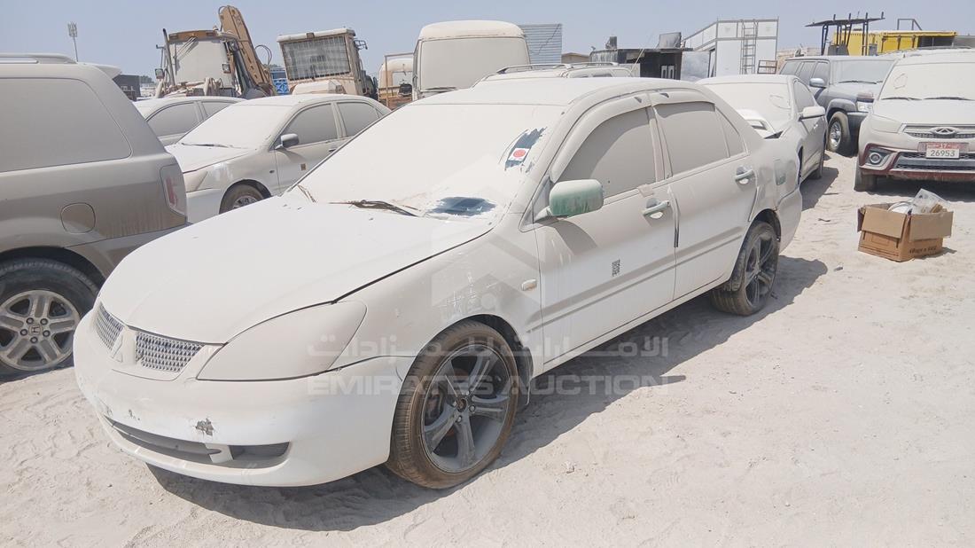ميتسوبيشي لانسر 2009 — الزاوية الأمامية اليسرى — صورة 5