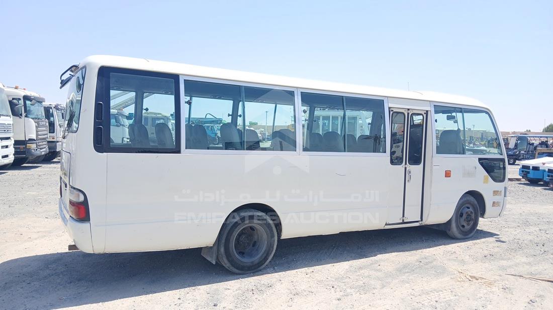 2012 Toyota Coaster — Rear Right Angle — Photo 9