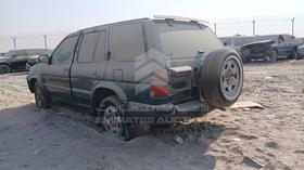 1996 Nissan Pathfinder — Rear Left Angle — Photo 6 — Thumbnail